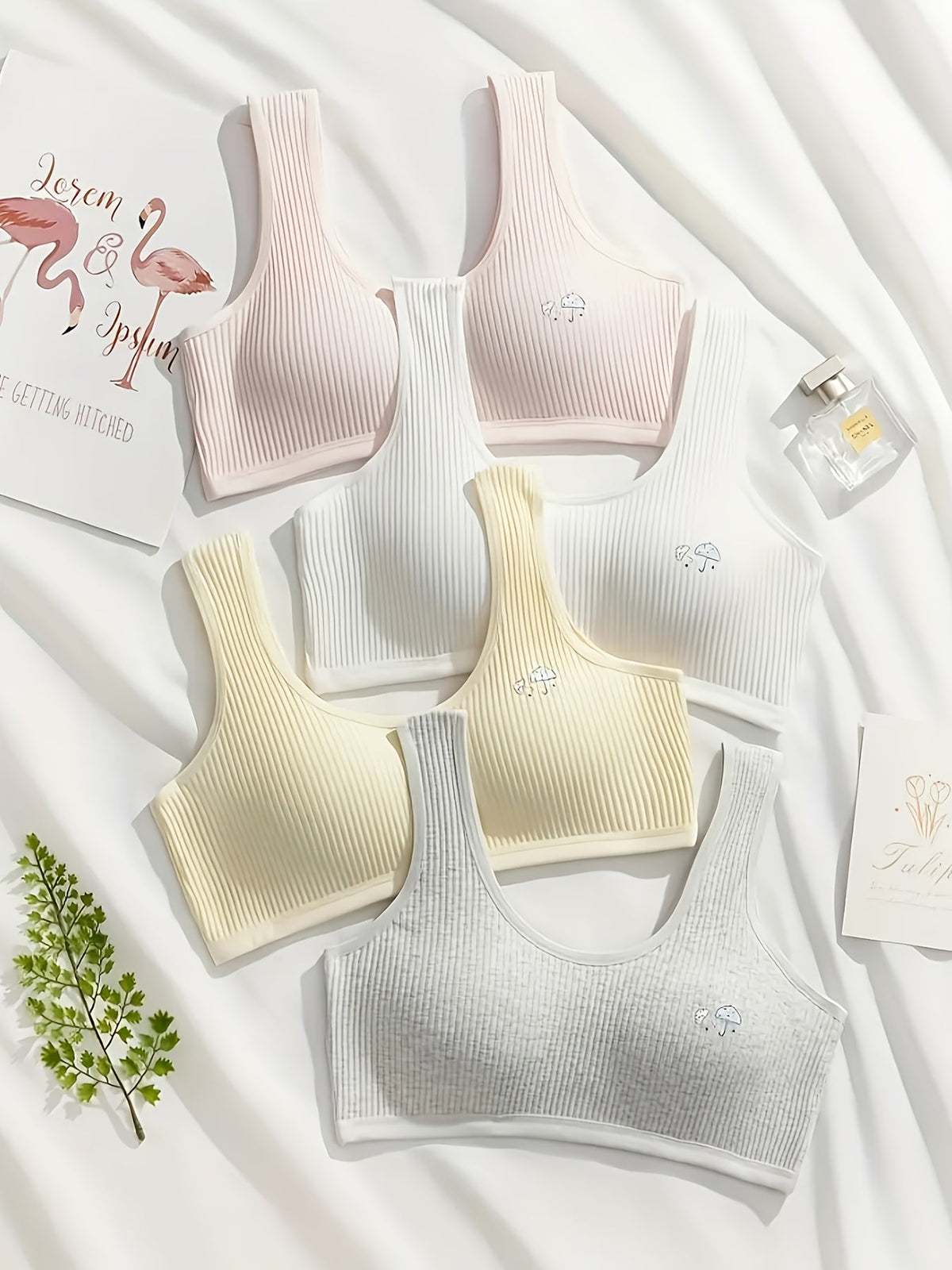 Girls' Ribbed Training Bras Four Pack with Removable Pads and Small Embroidered Details in Mixed Colors