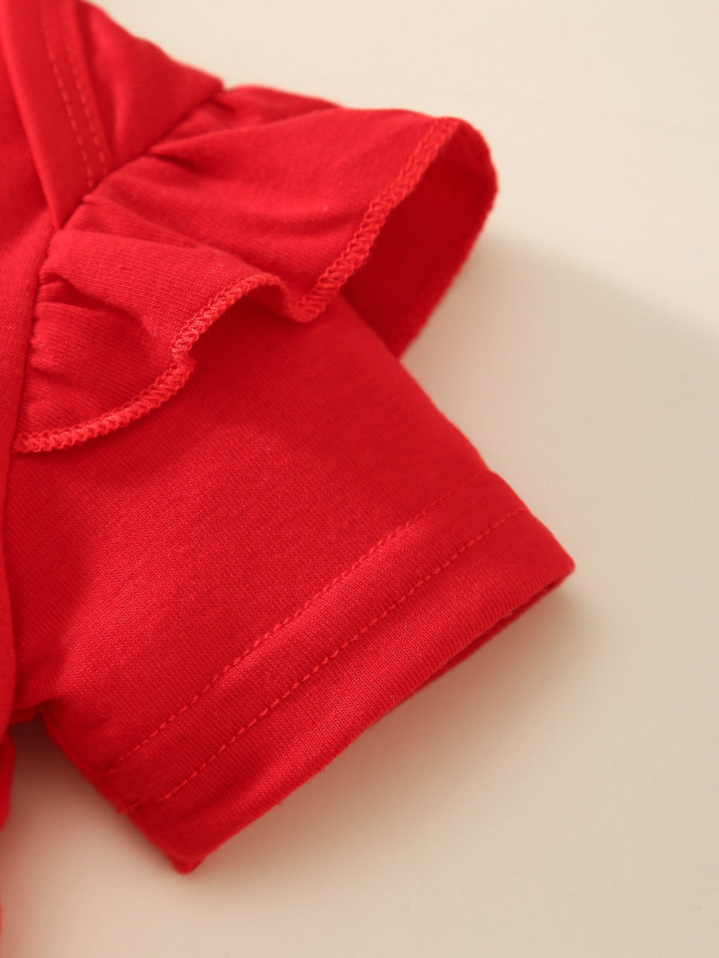 Baby Girl Outfit Set with a Red Ruffle Bodysuit and Star Print Pinafore for Fourth of July Celebrations