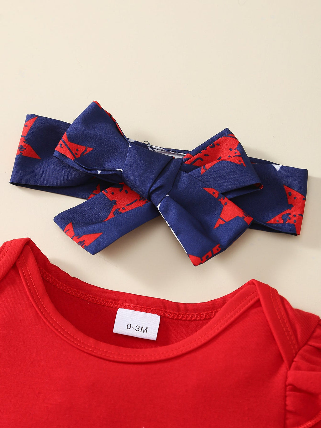 Baby Girl Outfit Set with a Red Ruffle Bodysuit and Star Print Pinafore for Fourth of July Celebrations