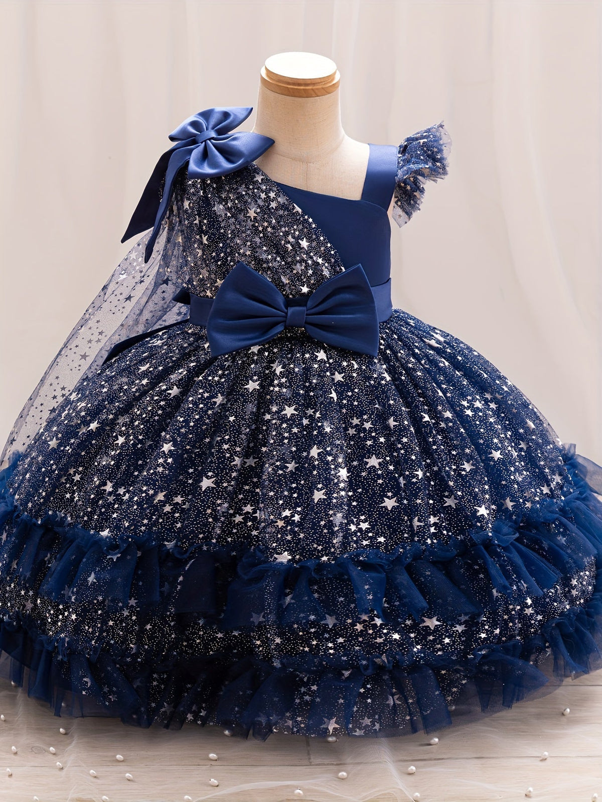 Girls' Star Tulle Party Dress with Large Bow Details and a Tiered Skirt for Birthdays and Celebrations